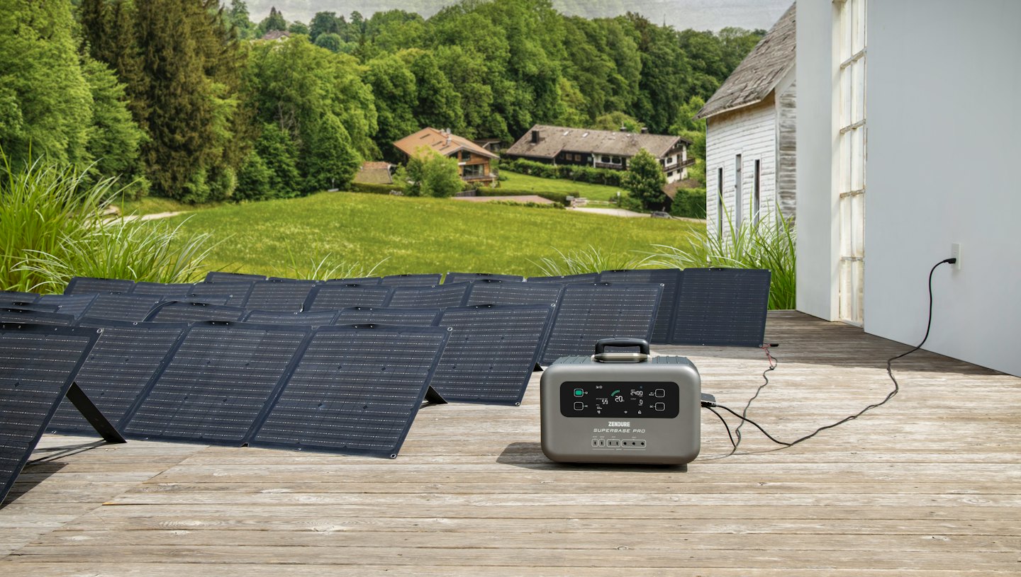 Solar panels and power station charging on a deck.
